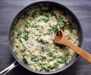 Creamy chicken risotto with spinach and Parmesan in pressure cooker