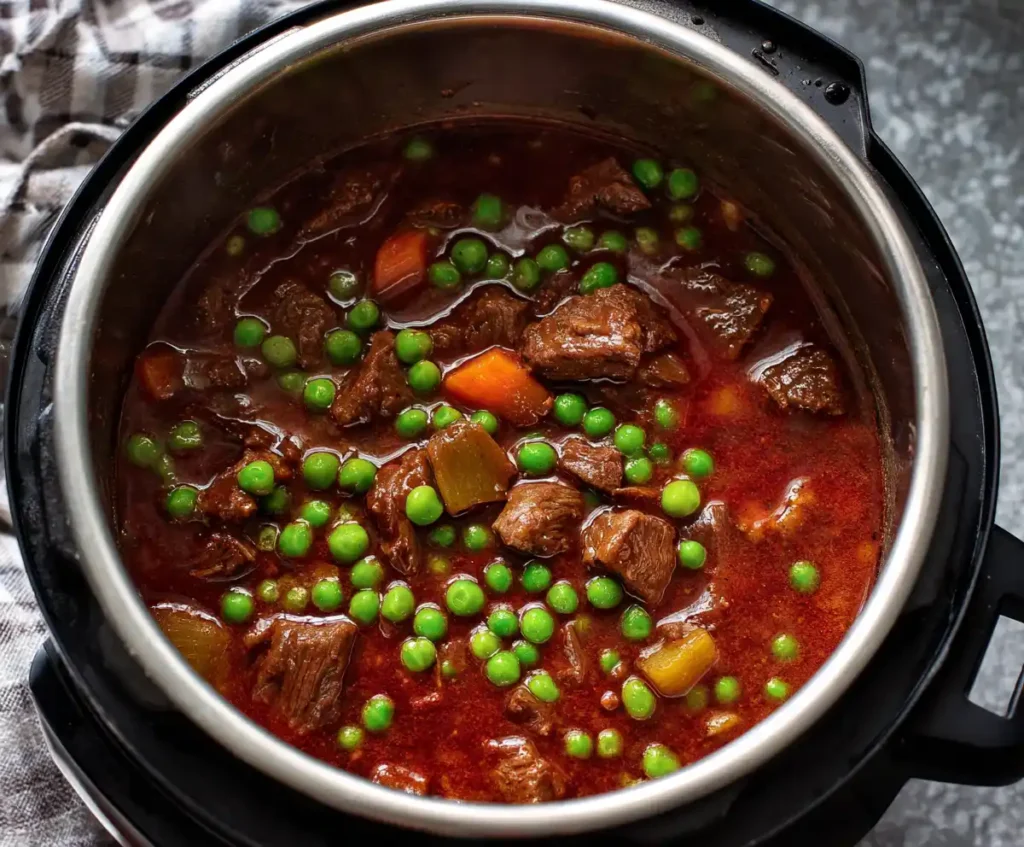 Instant Pot beef stew with carrots, potatoes, and peas