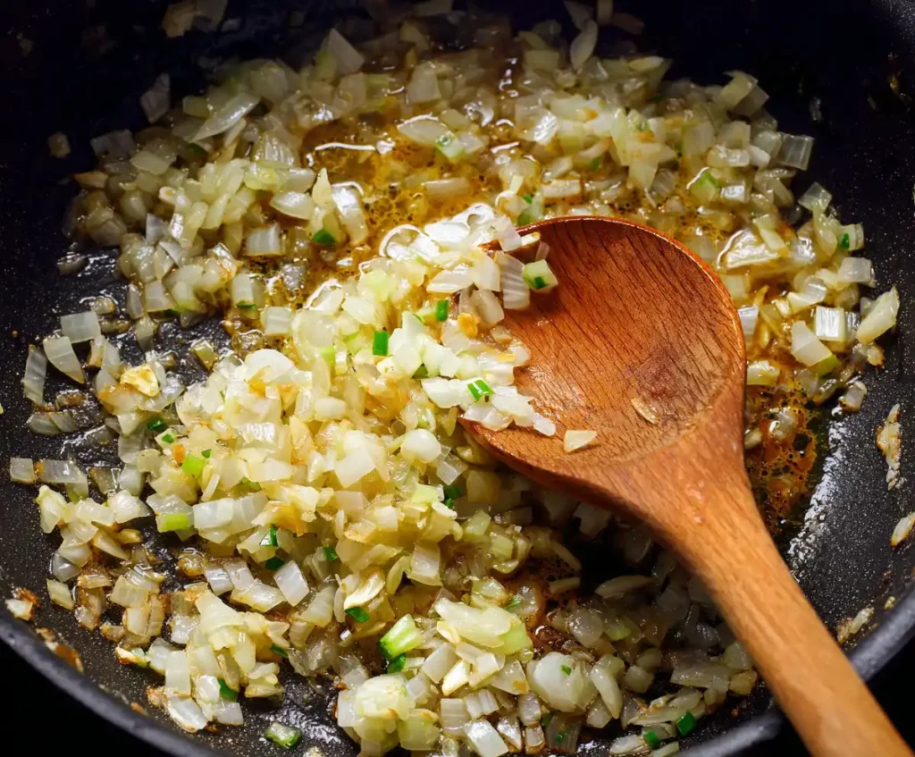 Onions and garlic sautéing in pressure cooker for risotto base