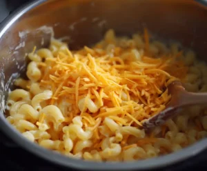 Shredded cheddar melting into macaroni for Instant Pot mac and cheese