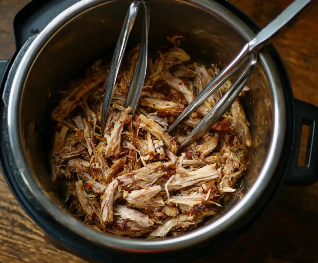 Shredded pork in Instant Pot after pressure cooking