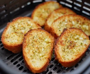 Crispy golden air fryer garlic bread fresh from the basket