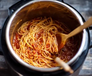 Cooked spaghetti mixed with meat sauce in Instant Pot