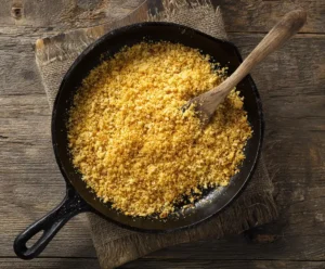 Golden toasted breadcrumbs in skillet for mac and cheese topping