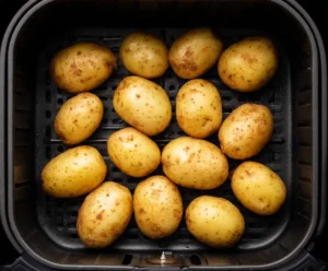 Potatoes placed in air fryer basket before cooking