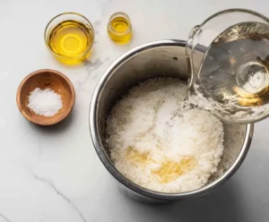 Rice and water added to Instant Pot with salt and oil before cooking
