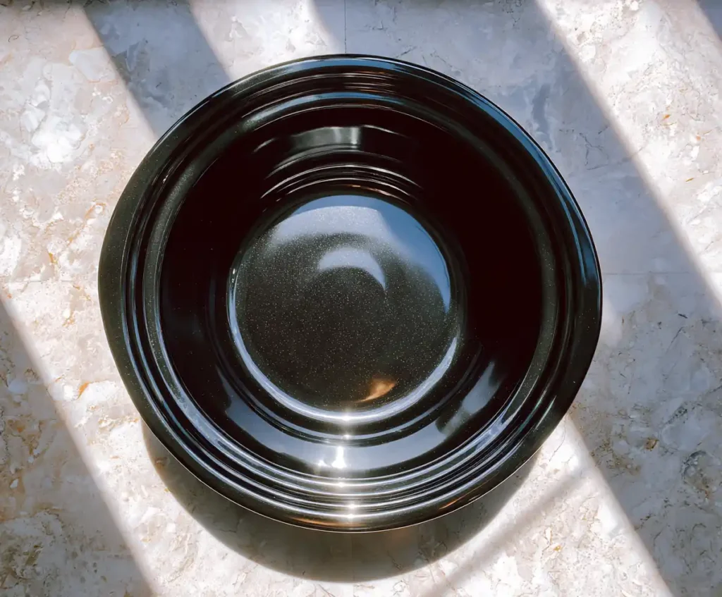 Slow cooker insert prepared with cooking spray for white chicken chili
